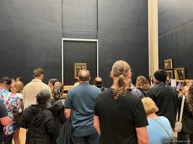 Mona Lisa with a crowd of people around her.